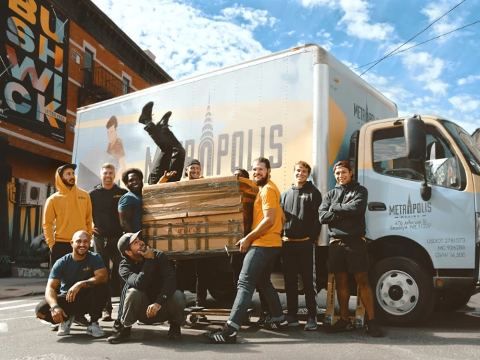 3 women standing beside white van during daytime